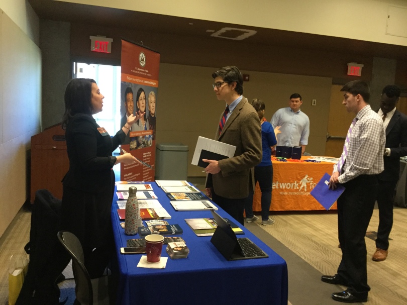 Image of a student speaking to a recruiter at the career fair