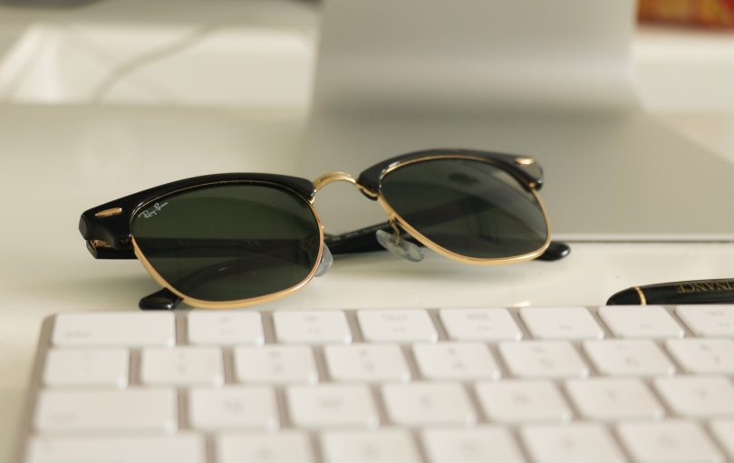 Image of sunglasses placed on top of a keyboard